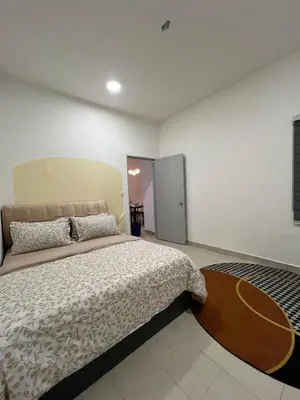 a bedroom with a large bed in a room at Mutiara Homestay cameron in Tanah Rata