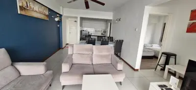 a living room with a couch and a dining room at A321 Silverpark Resort 1 lifted & Mountain view in Bukit Fraser