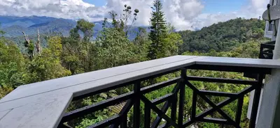 a balcony with a view of the mountains at A321 Silverpark Resort 1 lifted & Mountain view in Bukit Fraser
