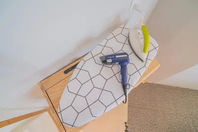 a white umbrella with a hammer and a yellow banana at Stylish 3BR Stay Near Gurney Drive Free Parking in George Town