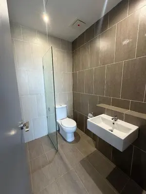 a bathroom with a toilet and a sink at Homey Studio Unit Relaxing Stay at Bayan Lepas in Gua Sai