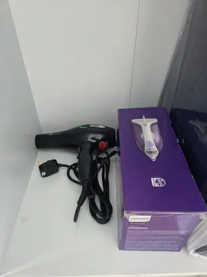 a nintendo wii game controller next to a purple box at Piccadilly Residence Greentown in Ipoh