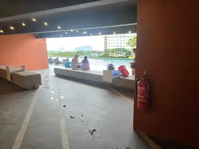 a group of people sitting on a bench in a building at Piccadilly Residence Greentown in Ipoh