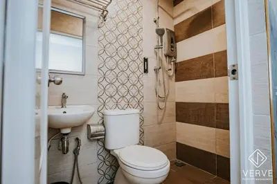 a bathroom with a toilet and a sink at Ipoh Town Area Avs Hotel by Verve in Ipoh