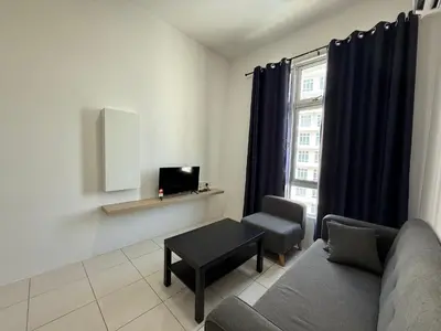 a living room with a couch and a table and a tv at 3pax Suite Ipoh Town The Anderson Residence #147 in Ipoh
