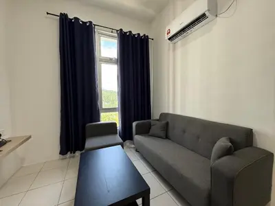 a living room with a couch and a window at 3pax Suite Ipoh Town The Anderson Residence #147 in Ipoh