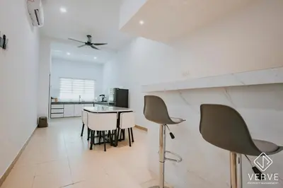 a kitchen and dining room with a table and chairs at Ipoh Summer Suite by Veve EECH05 in Gua Sai