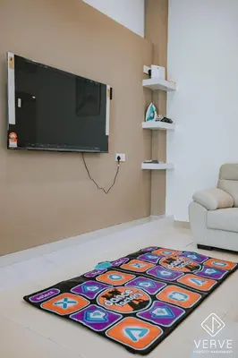 a living room with a colorful rug on the floor at Ipoh Summer Suite by Veve EECH05 in Gua Sai