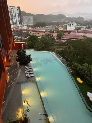 a large swimming pool on top of a building at Piccadilly Greentown by Jun Residence in Ipoh