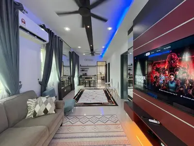 a living room with a large flat screen tv at Afiq's Homestay, Manjung in Seri Manjung