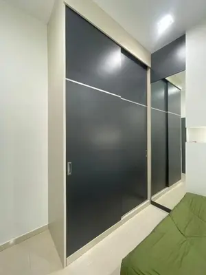 a bedroom with a large sliding glass door at Afiq's Homestay, Manjung in Seri Manjung