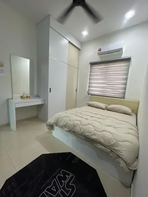 a bedroom with a bed with a window and a rug at Afiq's Homestay, Manjung in Seri Manjung