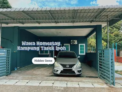 a car is parked in a parking lot at Wawa Homestay Ipoh in Ipoh