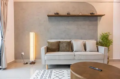 a living room with a couch and a table at Serene Japandi & Zen Family Retreat 2-7 pax with Comfortable Living Space in Tanah Rata