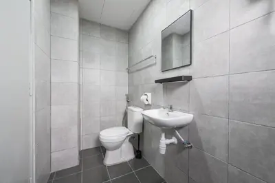 a bathroom with a toilet and a sink at Serene Japandi & Zen Family Retreat 2-7 pax with Comfortable Living Space in Tanah Rata