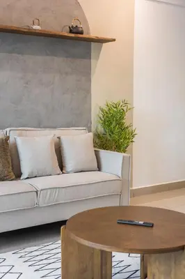 a living room with a couch and a table at Serene Japandi & Zen Family Retreat 2-7 pax with Comfortable Living Space in Tanah Rata