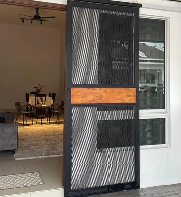 a door to a house with a dining room at NN Homestay Tasek Gelugor in Kampong Selamat