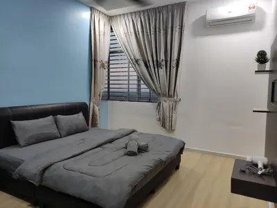 a bedroom with a large bed and a window at Cozyhaus Stay Sanctuary-Netflix-Pool- 1 Parking in Taiping