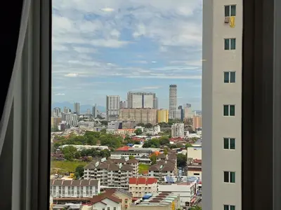 a view of a city from a window of a building at StayLuxe SGS 2BR Suite in George Town