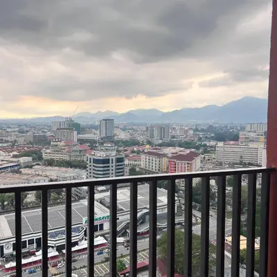 a view of a city from a balcony at Piccadilly Green Town Luxury Stay, Ipoh in Ipoh