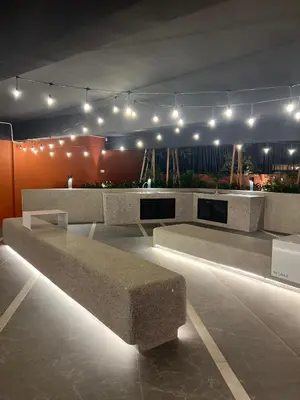 a bench in a room with lights on it at Piccadilly Green Town Luxury Stay, Ipoh in Ipoh