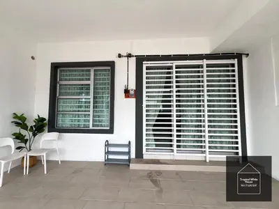 a room with two windows and a table and chairs at Ipoh Musllim Homestay Meru Tropika - 3 Bedrooms in Ipoh