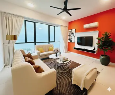 a living room with orange walls and white furniture at Peaceful Seaview Getaway Jazz Suite High Floor in Tanjong Tokong