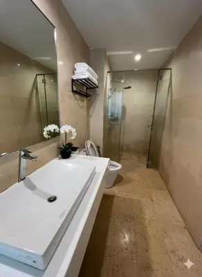 a bathroom with a sink and a toilet and a shower at Peaceful Seaview Getaway Jazz Suite High Floor in Tanjong Tokong