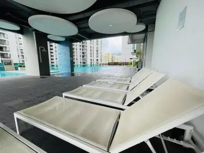 a row of beds in a room with a building at Peaceful Seaview Getaway Jazz Suite High Floor in Tanjong Tokong