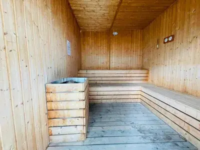 an empty wooden sauna with a wooden floor at Peaceful Seaview Getaway Jazz Suite High Floor in Tanjong Tokong