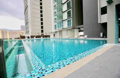 a swimming pool in the middle of a building at Peaceful Seaview Getaway Jazz Suite High Floor in Tanjong Tokong