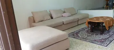 a living room with a couch and a table at D Seberang Homestay in Perai