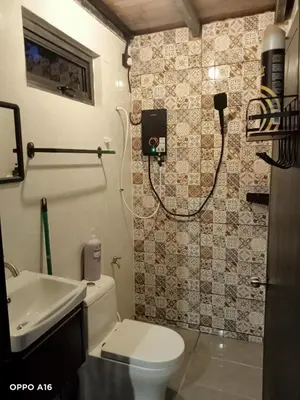 a bathroom with a toilet and a sink at Tepian Sawah Semanggol in Simpang Ampat Semanggol