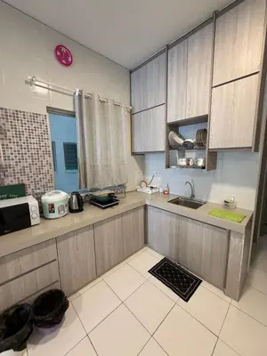a kitchen with a sink and a counter top at AYAAN Freesia Snooker House at Quintet Private Parking in Tanah Rata