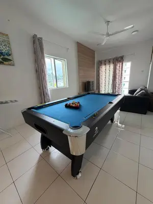 a billiard table in a living room with at AYAAN Freesia Snooker House at Quintet Private Parking in Tanah Rata