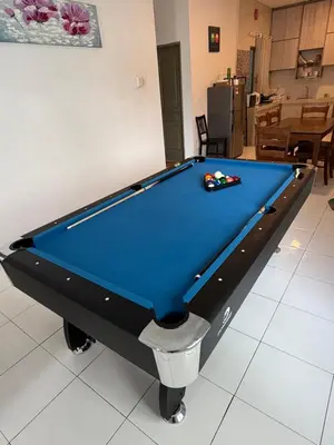 a pool table in a living room with at AYAAN Freesia Snooker House at Quintet Private Parking in Tanah Rata