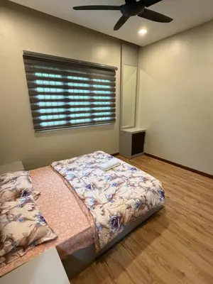 a bedroom with a bed and a ceiling fan at AYAAN MILLENIUM Family Homestay with Netflix and PS3 xprience Most Wanted 2012 and many more racing games in Tanah Rata
