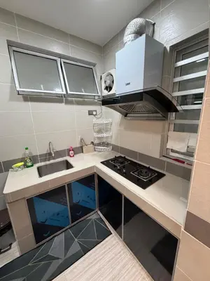 a kitchen with a sink and a stove at AYAAN MILLENIUM Family Homestay with Netflix and PS3 xprience Most Wanted 2012 and many more racing games in Tanah Rata