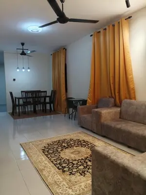a living room with a couch and a ceiling fan at FF Home - Homestay Teluk Intan in Teluk Intan