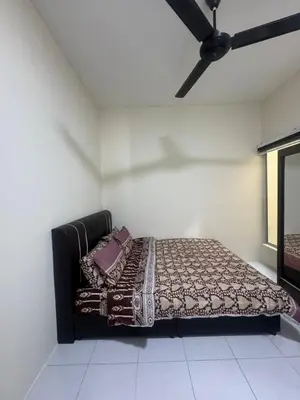 a bed in a room with a ceiling fan at FF Home - Homestay Teluk Intan in Teluk Intan