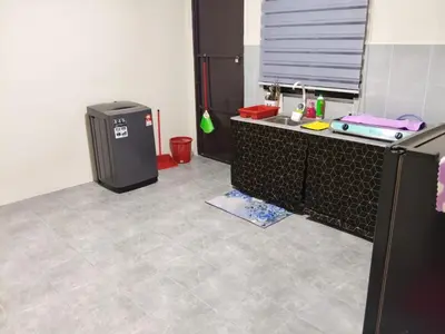 a kitchen with a sink and a refrigerator at FF Home - Homestay Teluk Intan in Teluk Intan