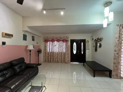 a living room with a couch and a table at Homestay Adelia SI in Seri Iskandar