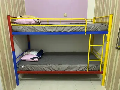 a bunk bed room with two bunk beds in it at Homestay Adelia SI in Seri Iskandar