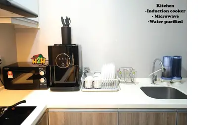 a kitchen counter with a coffee maker and a sink at H2H- Dreamy Home - Majestic Ipoh - 7 pax in Ipoh