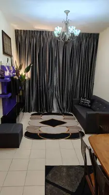 a living room with a black curtain and a couch at Zamdynas HomestayMuslim Cameron Highland in Tanah Rata