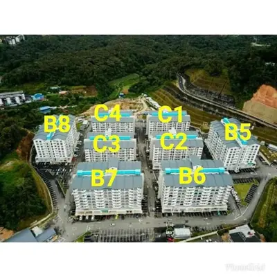 a group of buildings with yellow numbers on them at Zamdynas HomestayMuslim Cameron Highland in Tanah Rata
