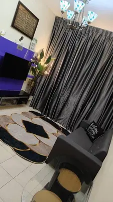 a room with a chair and a curtain in a store at Zamdynas HomestayMuslim Cameron Highland in Tanah Rata