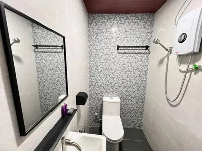 a bathroom with a toilet and a sink and a shower at Aurelia Stay in Brinchang
