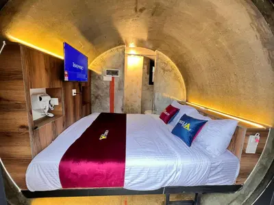 a bedroom with a bed in a tunnel at Aurelia Stay in Brinchang