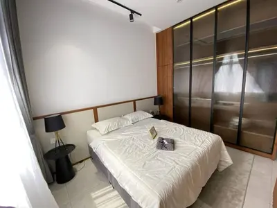 a bedroom with a bed with a book on it at Scafie apartment 001